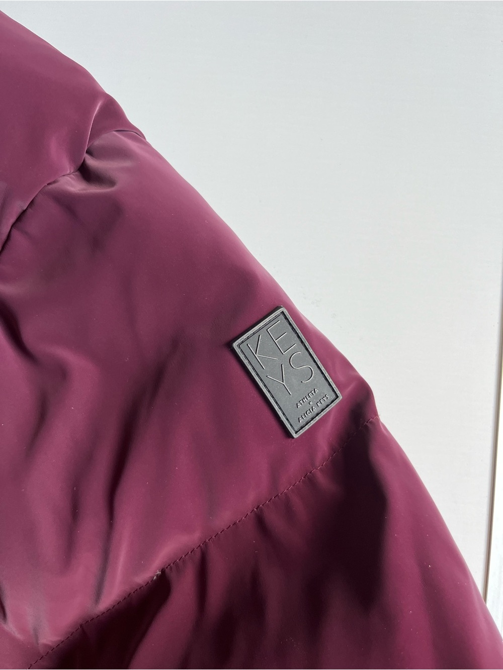 Athleta x Alicia Keys Quilted Burgundy Puffer Jacket with Gold Zippers - Picture 5 of 10